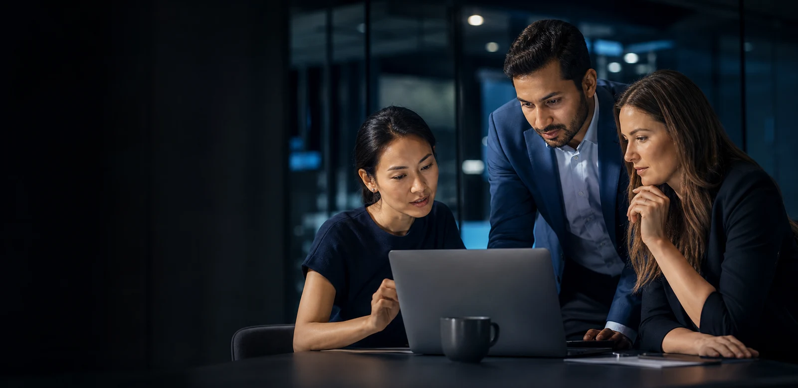 Illustrative scene of people collaborating around a laptop
